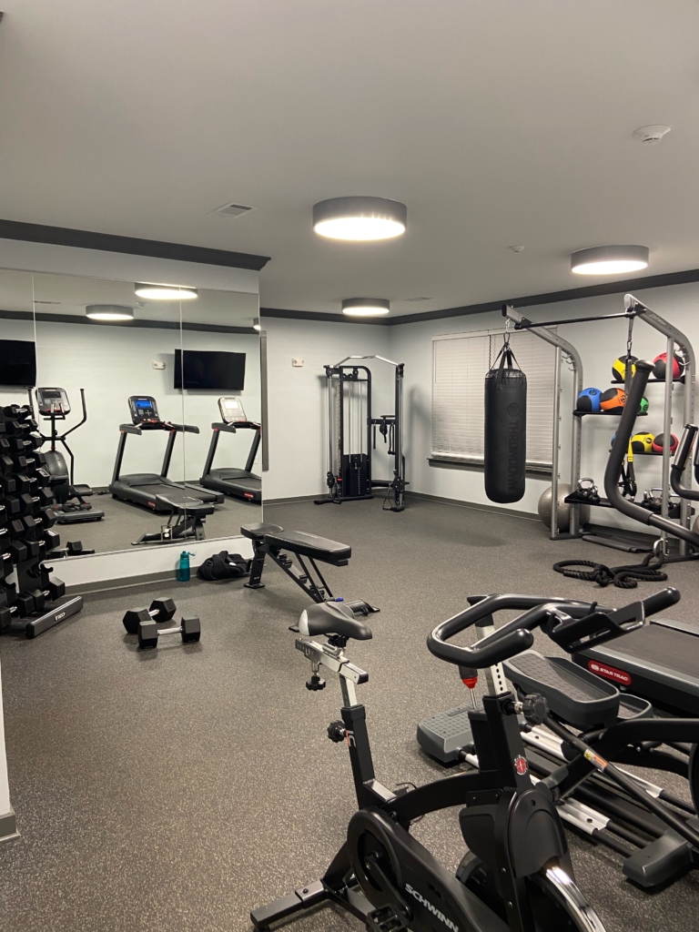 empty apartment gym, a perfect workout space for an introvert